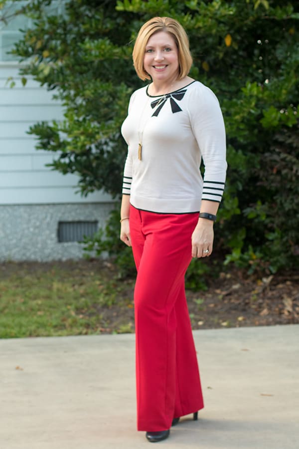 red pants and bow sweater top