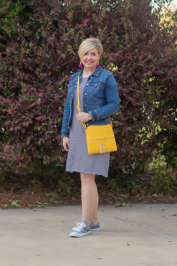 denim jacket with stripe dress and sneakers