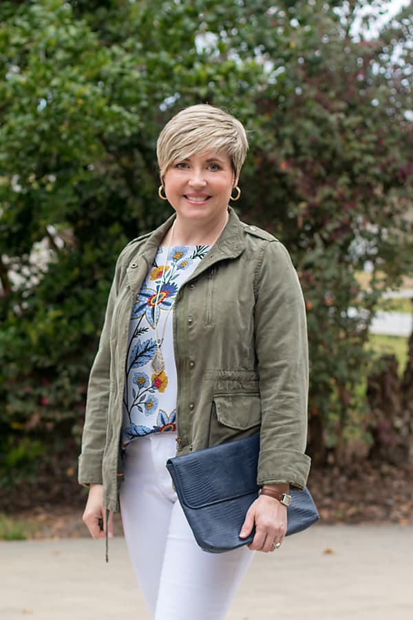 fashion blogger in utility jacket and hoop earrings