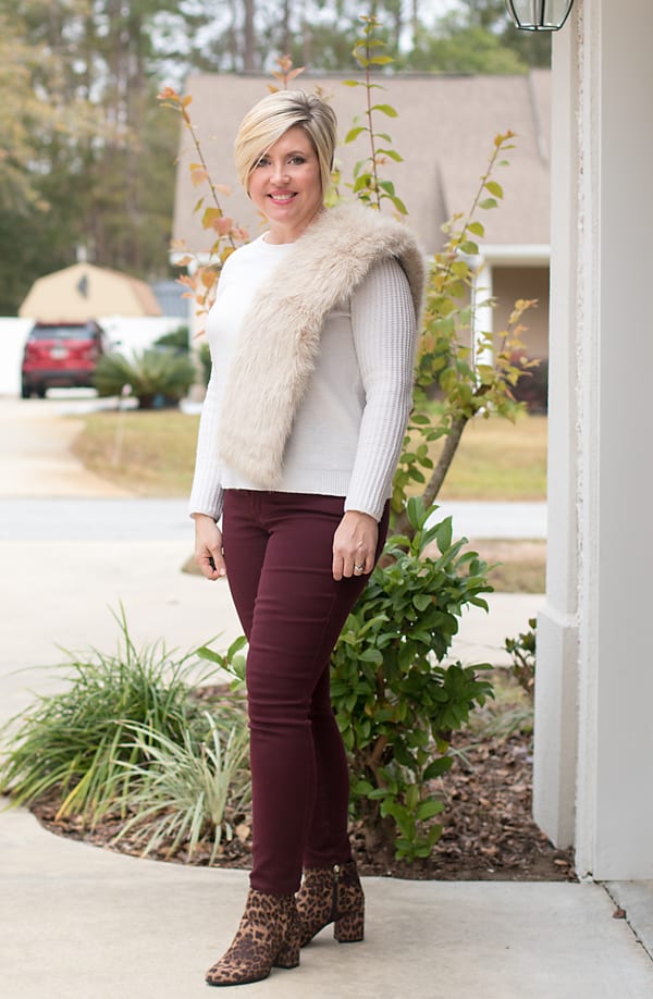 holiday party outfit with faux fur scarf and leopard boots