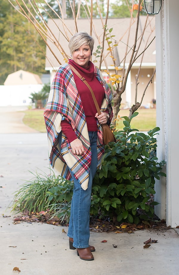 sweater and boot cut jeans with plaid blanket scarf Christmas winter outfit