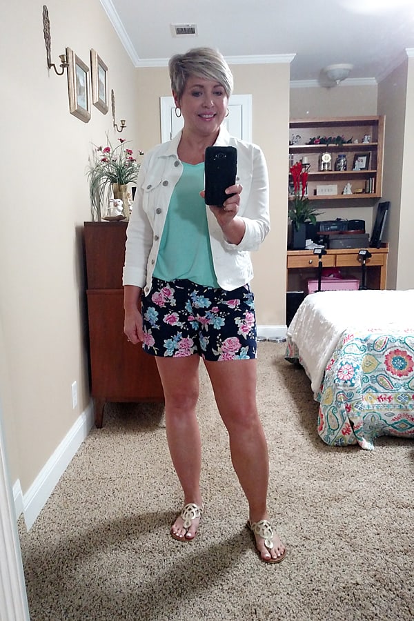 white denim jacket with floral shorts