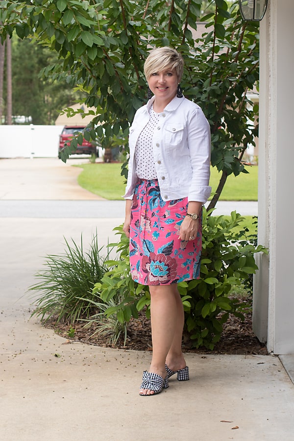 white denim jacket with floral skirt over 40