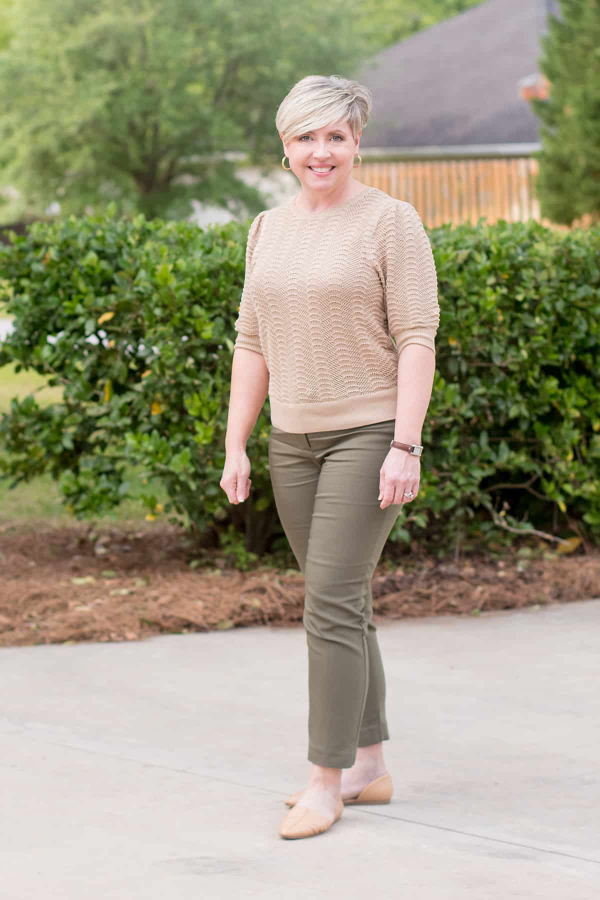 spring office outfit for women with olive pants and beige sweater