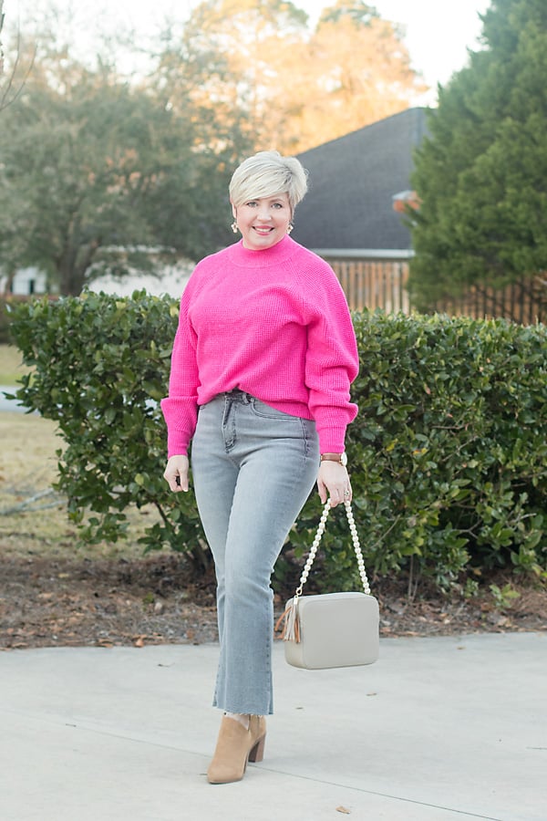 fuschia sweater with grey jeans winter outfit