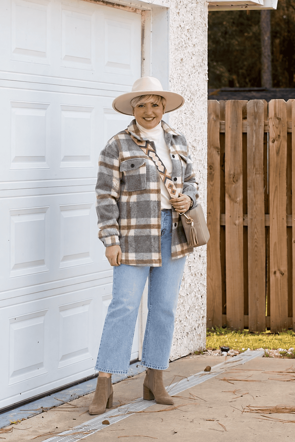 plaid shacket and light wash jeans