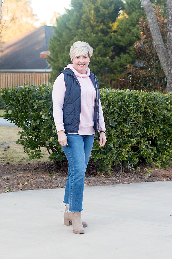 hoodie with jeans and vest women's outfit