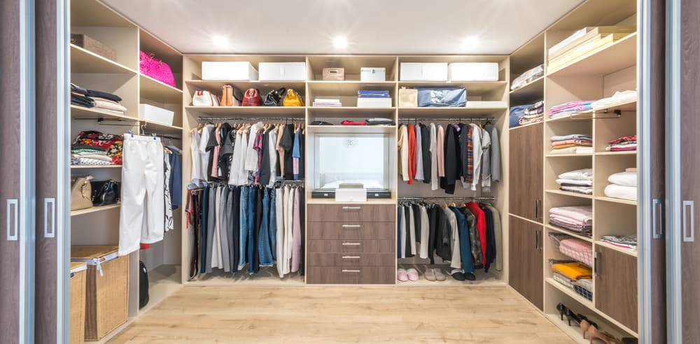 organized closet with staging area; how to spring clean your closet