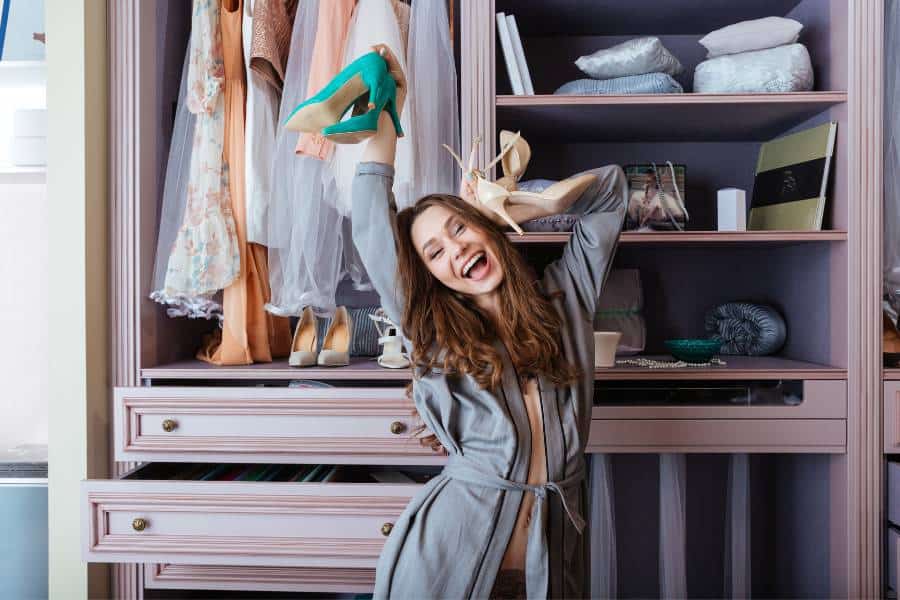 happy woman in front of closet