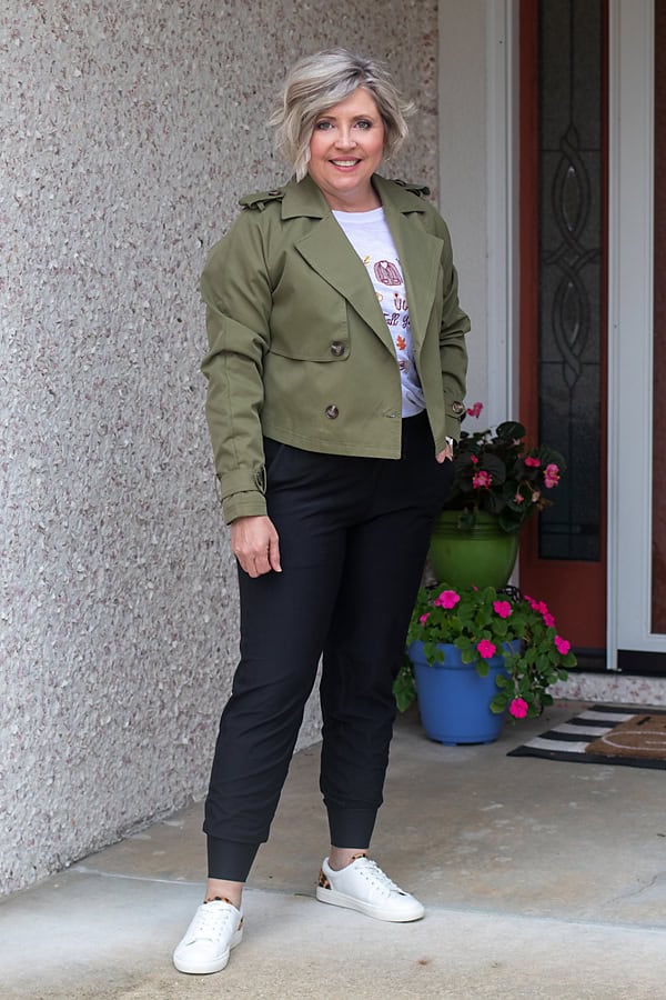 black joggers outfit with cropped trench