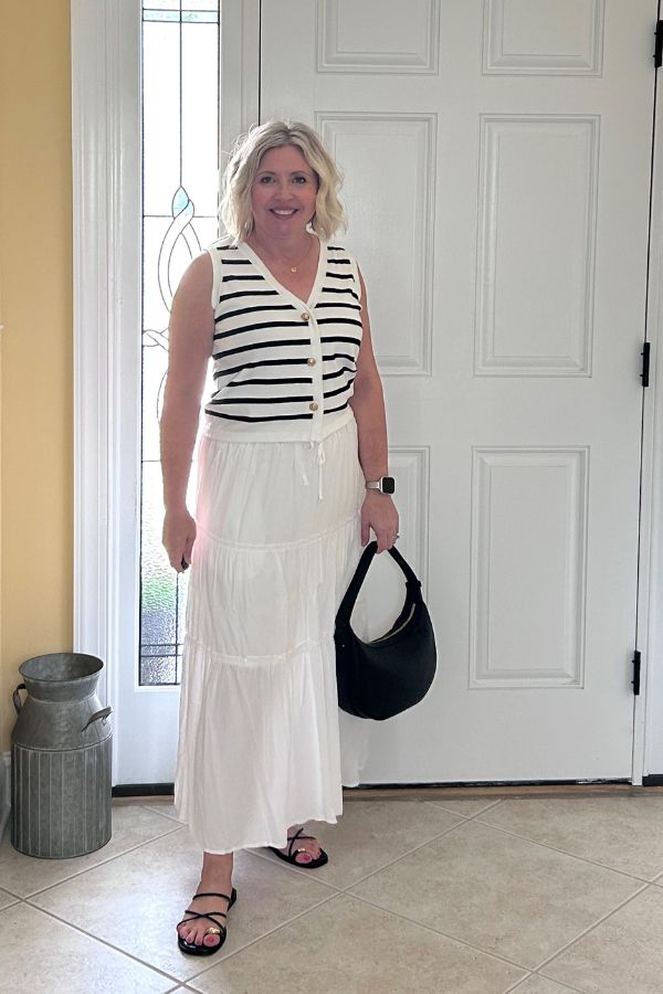 white maxi skirt outfit with striped sweater vest