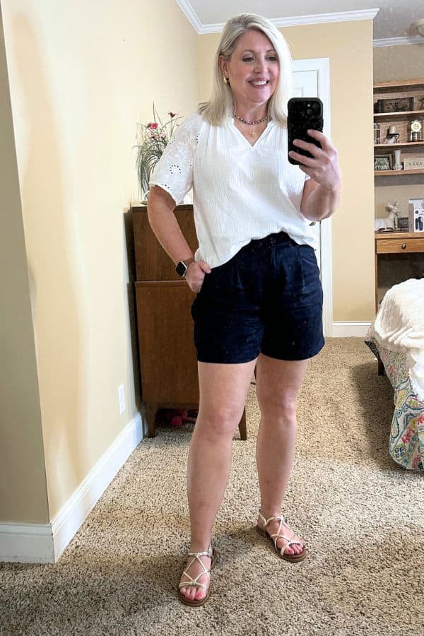 navy shorts outfit with white flutter sleeve top